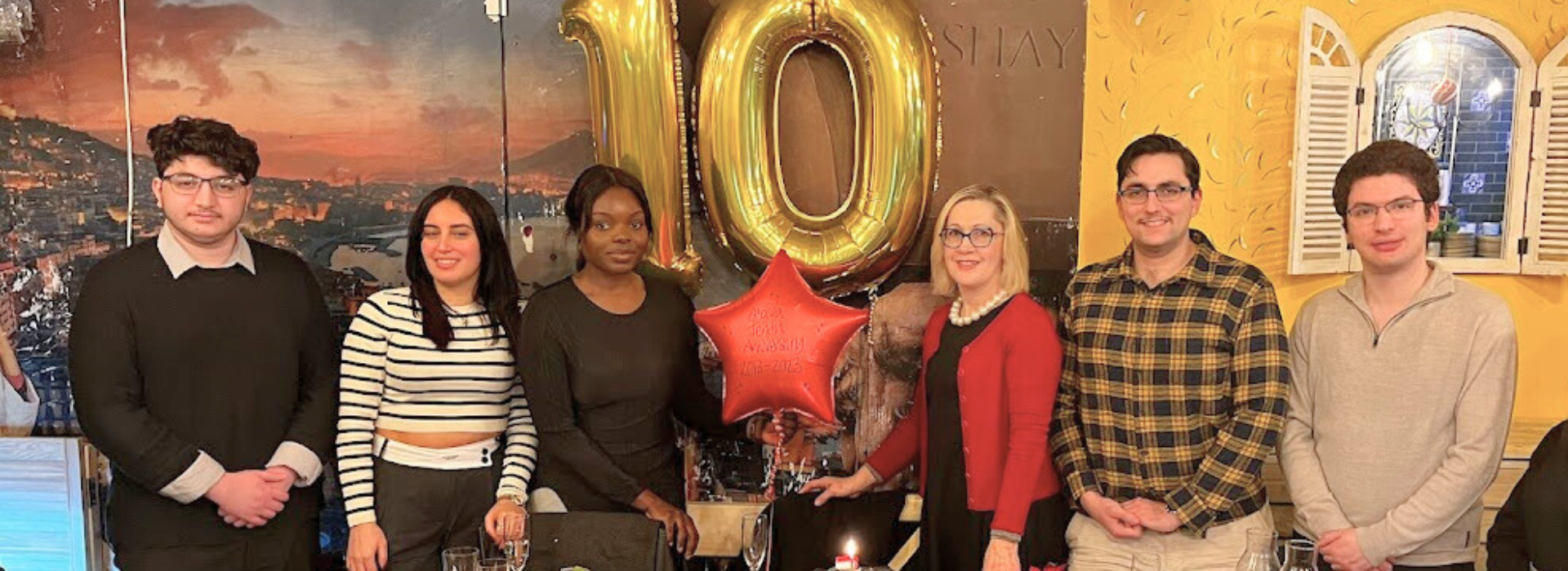 Atava Education staff celebrating 10 years as education consultants in the UK