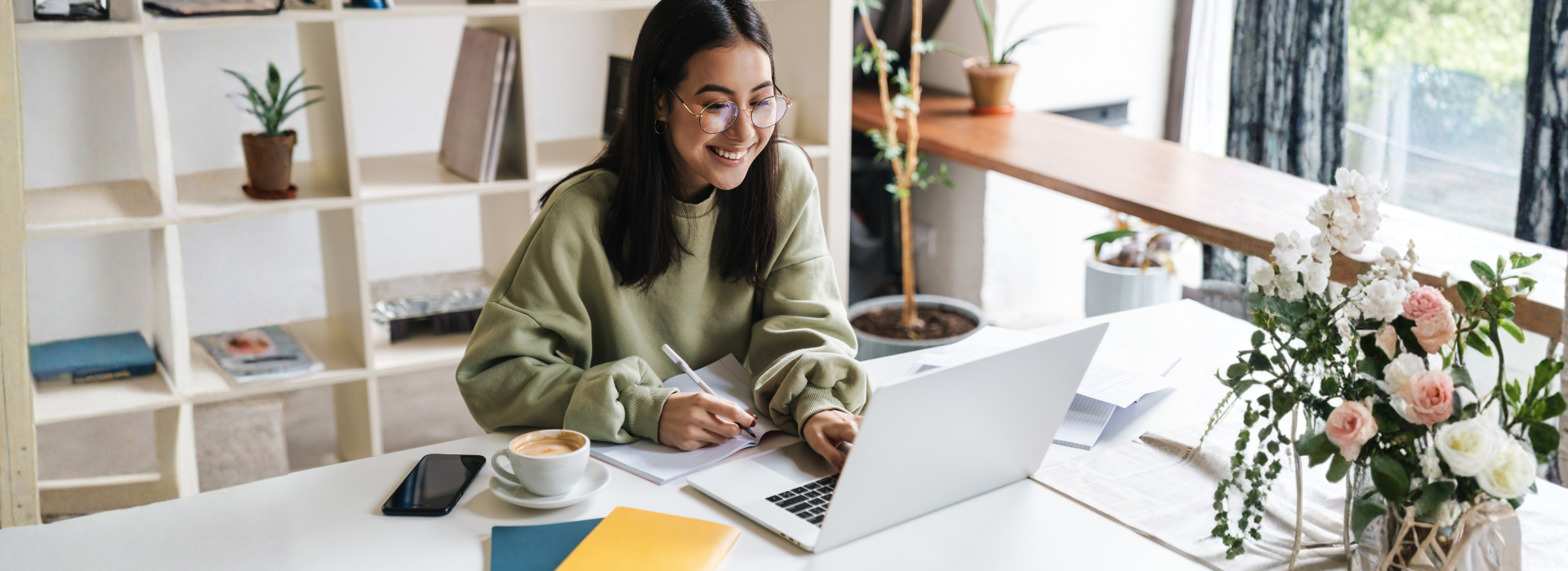 Student checking Confirmation of Acceptance for Studies details on laptop