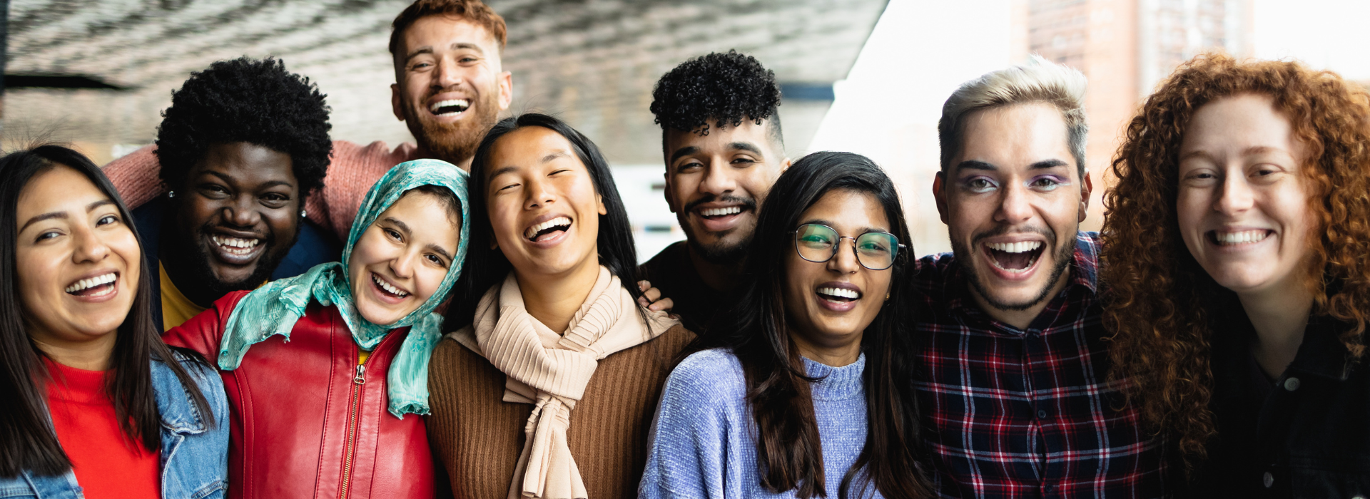 Diverse group of international students smiling together, representing inclusiveness, trust, and community in education
